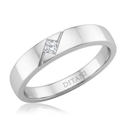 Silver ring with a square-cut diamond set diagonally, inner engraving reads DITAN.