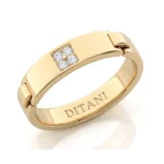 Gold ring with a square cluster of four diamonds and 'DITANI' engraved on the inner band.