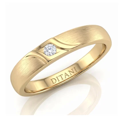 Gold ring with a brushed band, a single bezel-set diamond, and 'DITANI' engraved inside the band?