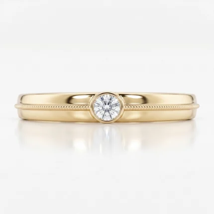 Gold ring with a single round diamond centerpiece on a polished band.