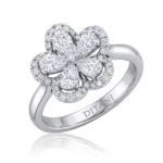 Diamond flower ring set in white gold with pavé halo and a polished band.