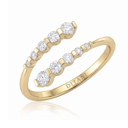 Gold ring with a row of sparkling diamonds set along the band, inner inscription reads 'DITANI'
