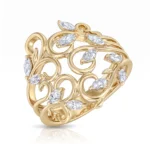 Ornate gold ring with curling filigree and marquise-cut diamonds around the band