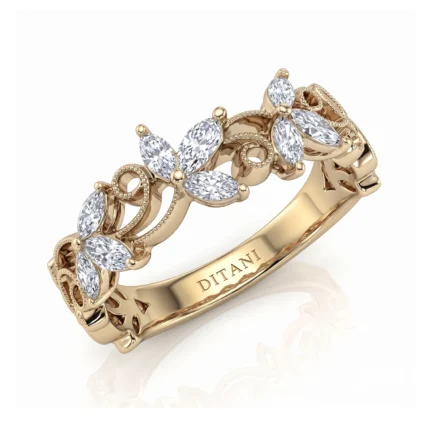 Gold ring with a floral vine design and diamond marquise shapes, featuring beaded edging on a polished band (DITANI inscription visible).