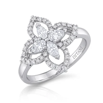 Silver ring with a floral cluster of four marquise-cut diamonds surrounded by a pavé diamond halo.