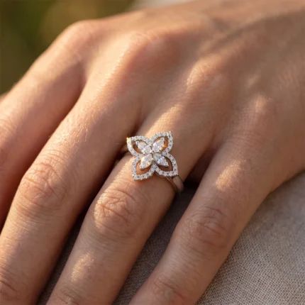 Diamond butterfly ring with pavé diamonds on a finger, close-up detail of the jewelry.