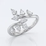 Ring with a branchy, leaf-inspired design featuring multiple diamond stones along a polished silver band; inner engraving reads DITTANI
