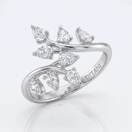 Ring with a branchy, leaf-inspired design featuring multiple diamond stones along a polished silver band; inner engraving reads DITTANI