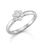 Silver ring featuring a seven-diamond flower cluster on a polished band, with engraving inside the shank.