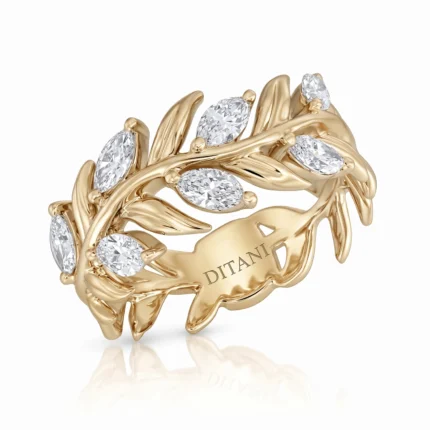 Gold vine-inspired ring with marquise-cut diamonds and 'DITANI' engraving on the band.