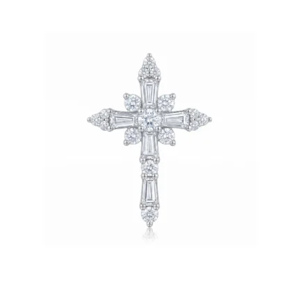 Cross-shaped diamond pendant with round and baguette-cut stones on a polished metal setting against a white background.