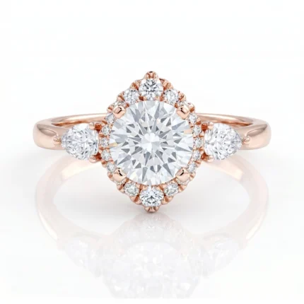Rose gold engagement ring with a large round center diamond, surrounded by a double halo of smaller diamonds and two side stones