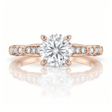 Rose gold engagement ring with a large center round diamond in a four-prong setting and pavé diamonds along the band.