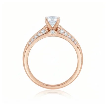 Rose gold engagement ring featuring a large central round diamond in a three-prong setting with pavé diamonds along the shoulders of the band