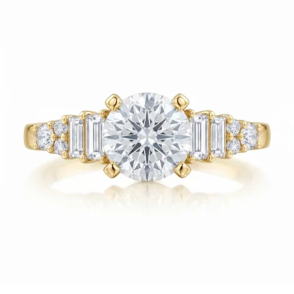 Yellow gold engagement ring with a large round center diamond and baguette and round side stones on the band.