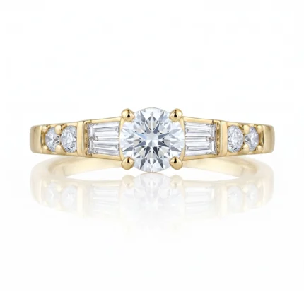 Yellow gold ring with a large round center diamond in a four-prong setting, flanked by baguette and round diamonds on the band.