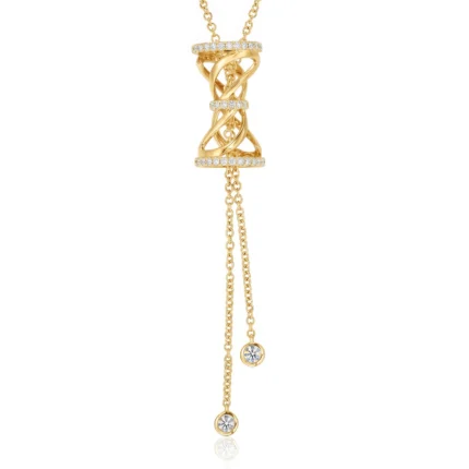 Gold pendant necklace with intertwined rings studded with diamonds and dangling chain extensions featuring crystal charms