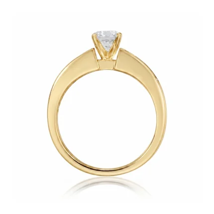 Gold engagement ring with a diamond solitaire held by a four-prong setting.