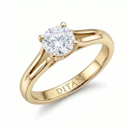 Gold engagement ring with a round diamond solitaire in a four-prong setting; polished yellow gold band