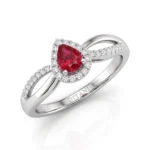 Pear-cut red gemstone engagement ring with a halo of small diamonds, set in a white metal band with pavé diamonds along the shank (brand: DITANI)