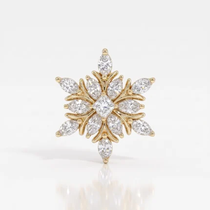 Gold-toned floral starburst brooch encrusted with clear diamonds arranged in petal shapes central diamond
