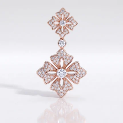 Rose gold pendant with three diamond-encrusted floral shapes in a vertical drop, largest bloom at the bottom with a central diamond