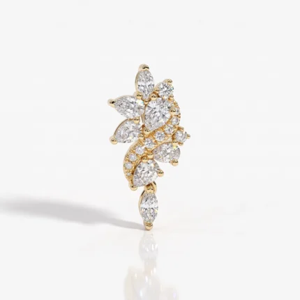 Gold ring set with diamonds forming a floral, vine-like bouquet of blossoms