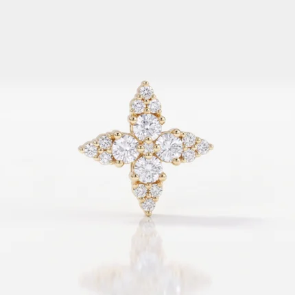 Cross-shaped gold ring set with round diamonds, centered prominently with a reflective surface below.