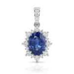 Oval deep-blue sapphire pendant surrounded by a diamond halo in white gold.