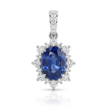 Oval deep-blue sapphire pendant surrounded by a diamond halo in white gold.
