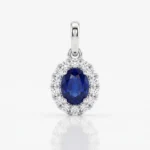 Oval blue sapphire pendant surrounded by a diamond halo in a white-gold setting.