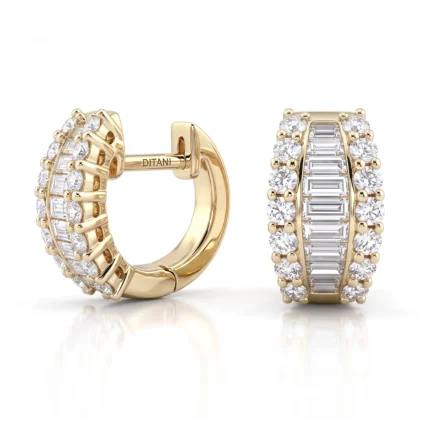 Gold hoop earrings with diamonds arranged around the front face in alternating shapes (round and baguette cuts).