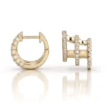 Gold hoop earring with diamonds along the outer edge and a hinged clasp