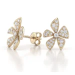 Gold flower-shaped stud earrings encrusted with diamonds, five-petal design.