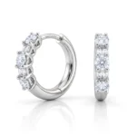 White-gold diamond ring shown from side and front, with round and baguette stones and 'DITANI' engraving on the band