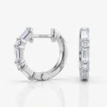 Silver hoop earring with baguette and round diamonds set around the band, side and front views visible, engraved post reads 'DITANI'