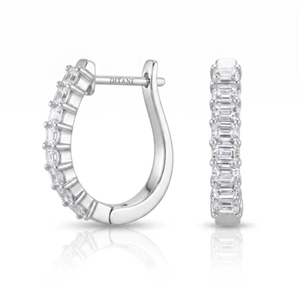 Diamond-studded white-gold hoop earring shown from two angles, with baguette-cut stones along the hoop and a post engraved 'DITANI'.
