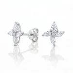 Flower-shaped diamond stud earrings in white metal with marquise-cut petals, Ditani brand visible on backing.