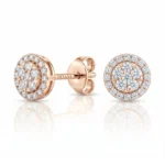 Rose-gold diamond halo stud earrings with a circular cluster of diamonds and a butterfly back.