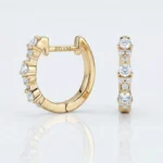 Gold hoop earring encrusted with diamonds along the outer edge, with 'DITANI' etched on the inner stem, beside a matching diamond ring in the image.