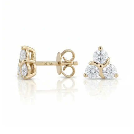 Gold stud earrings in yellow gold featuring a three-diamond cluster (three round-cut diamonds) with screw-back posts by Ditani