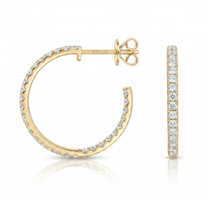 Gold hoop earring with diamonds around the rim and a matching diamond-studded ring beside it, both in polished yellow gold