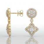Gold drop earrings with diamond halos; circular top and hanging diamond-encrusted motif beneath.