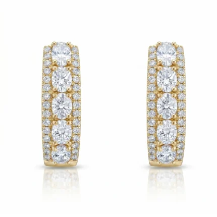 Gold hoop earrings encrusted with diamonds along the front, featuring three large oval stones per earring.