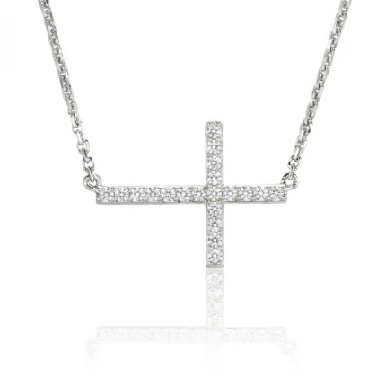 Silver necklace with a diamond-studded cross pendant hanging from a chain.