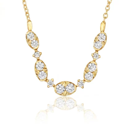 Gold-tone necklace with diamond-studded links forming a curved strand on a white background.