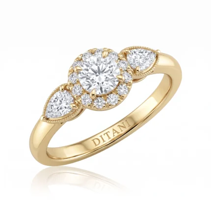 Gold ring with a large central round diamond surrounded by a halo of smaller diamonds and teardrop-shaped side stones. Its intricate setting adds vintage sparkle.