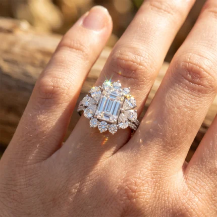 Close-up of a large emerald-cut diamond ring with a halo of smaller diamonds on a woman's finger in sunlight.