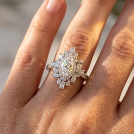 Close-up of an oval-cut diamond ring with a halo of smaller diamonds and baguette-cut stones on a finger.