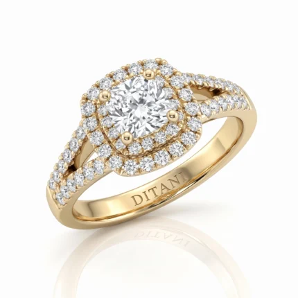Gold ring with a large central diamond surrounded by two halos of smaller diamonds and a pavé band, engraved 'DITANI' on the inner band